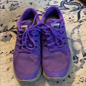 Purple Nike running shoes